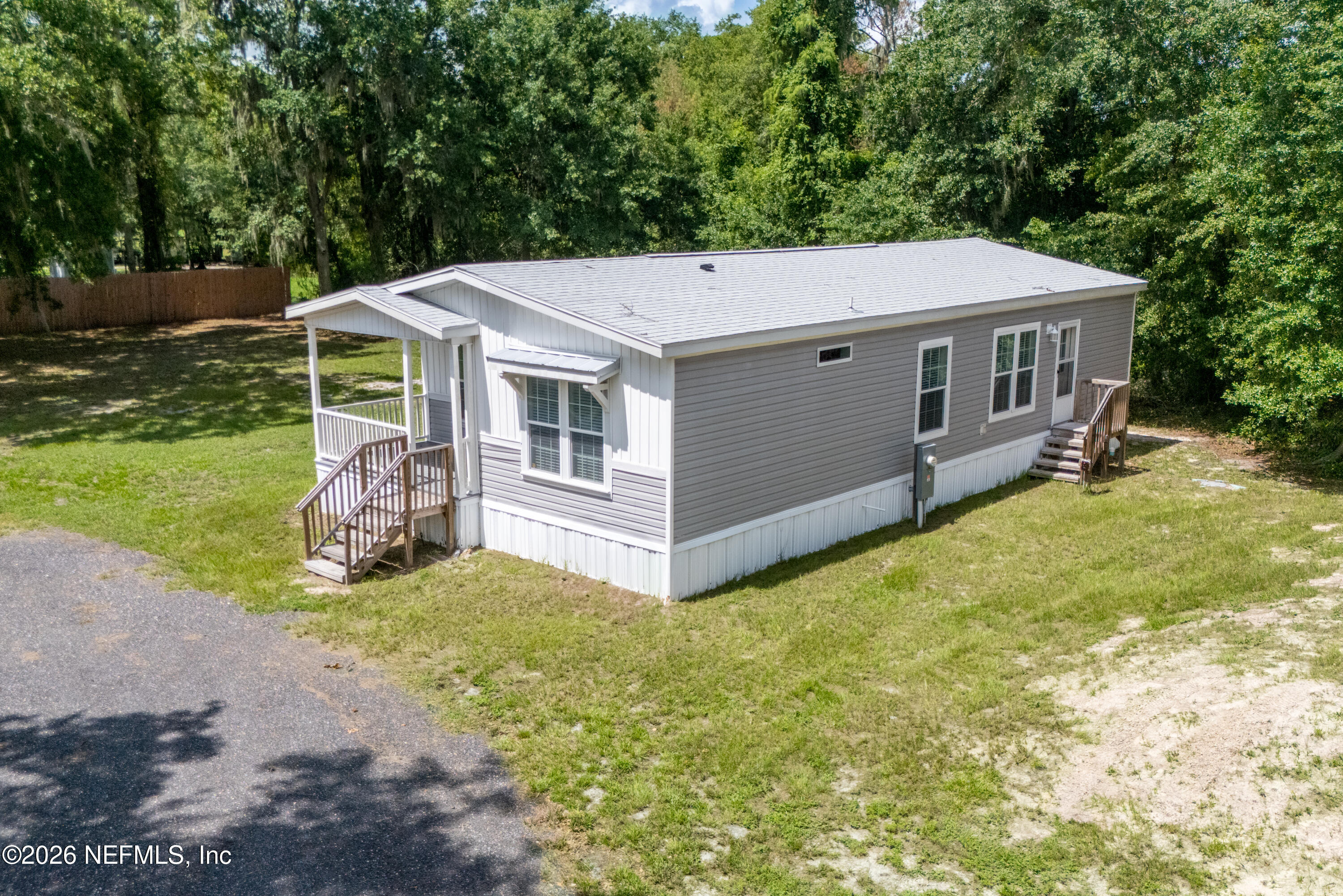 15049 Southwest 75th Avenue Starke, FL 32091 - Photo 21 of 64 a view of a house with a yard