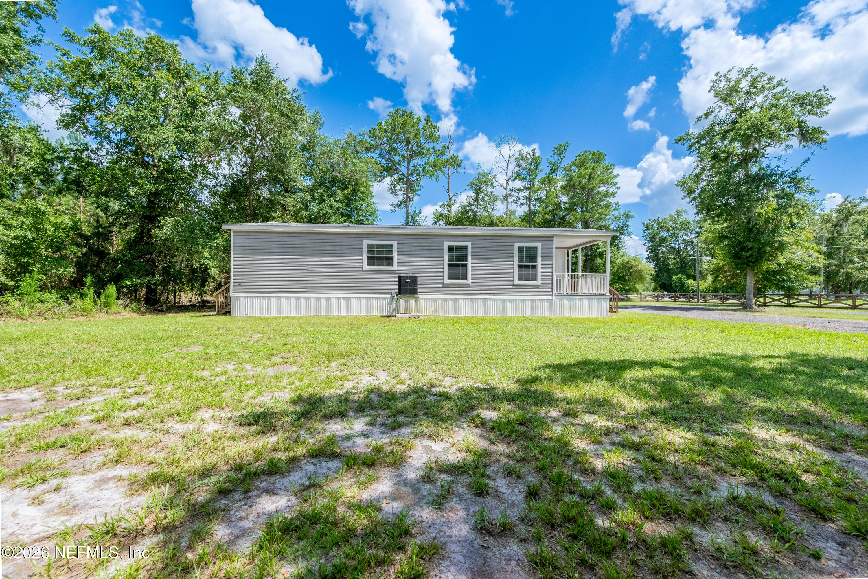 15049 Southwest 75th Avenue Starke, FL 32091 - Photo 27 of 64 a house view with a garden space