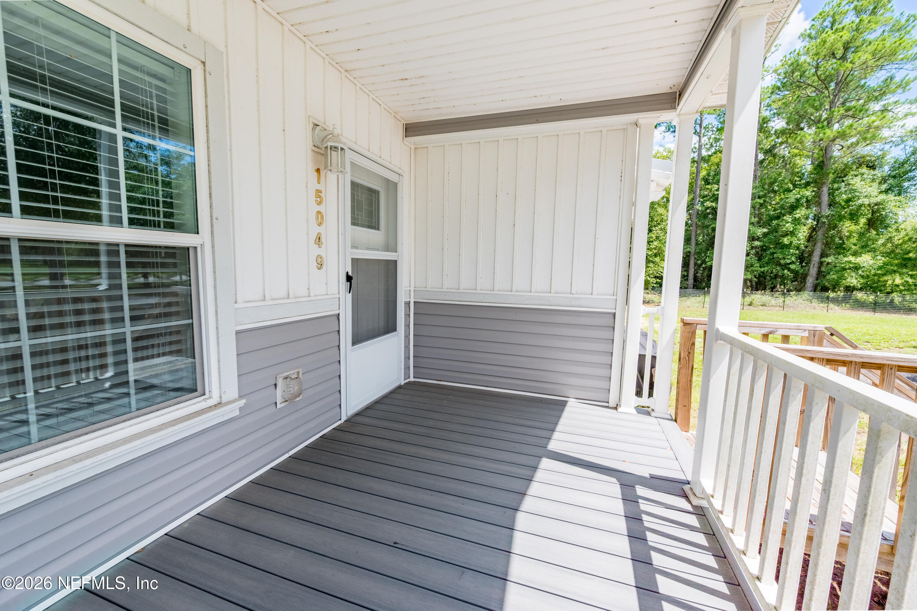 15049 Southwest 75th Avenue Starke, FL 32091 - Photo 29 of 64 a view of a balcony with wooden floor