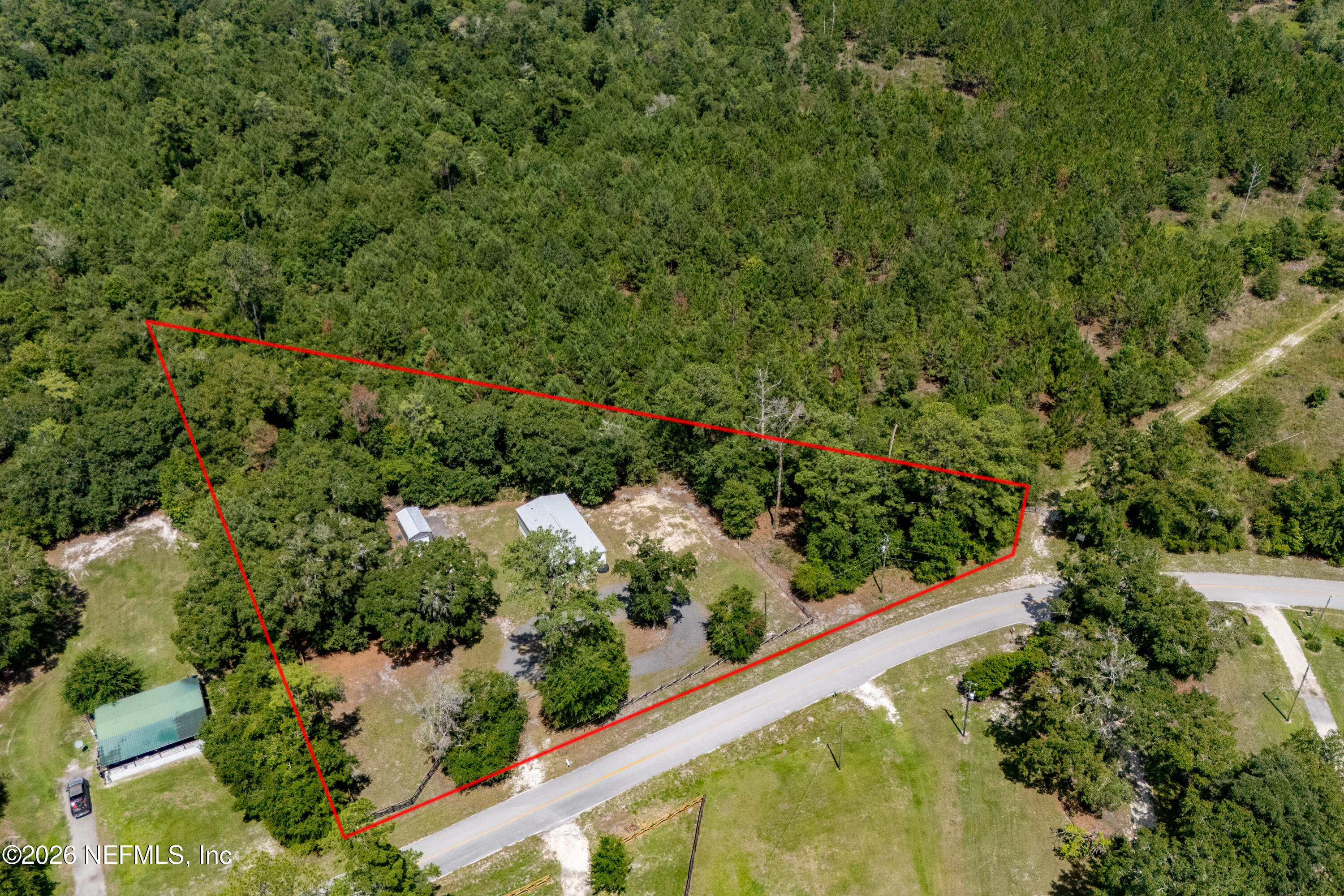 15049 Southwest 75th Avenue Starke, FL 32091 - Photo 30 of 64 a view of a garden with a building