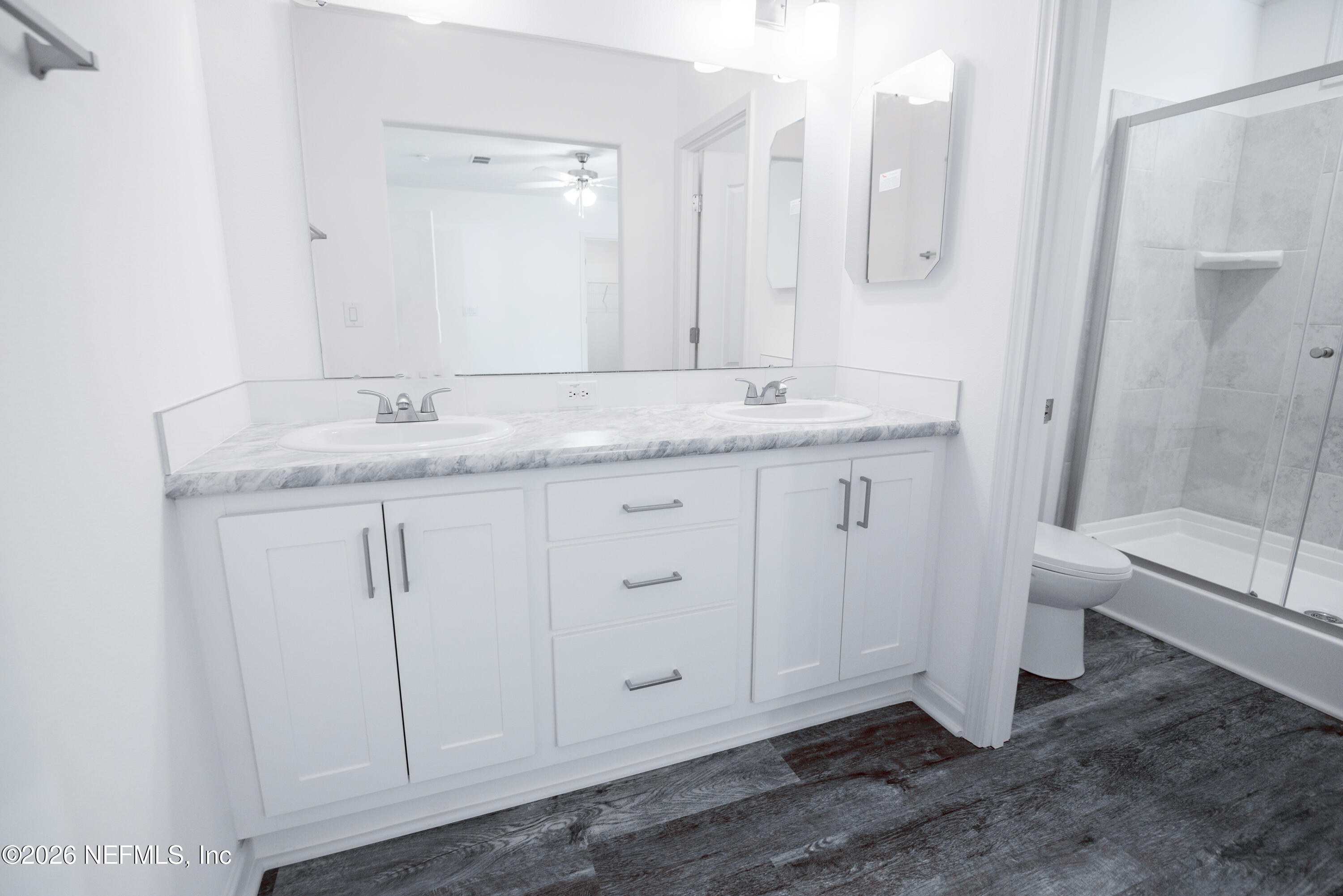 15049 Southwest 75th Avenue Starke, FL 32091 - Photo 3 of 64 a bathroom with a granite countertop sink and a mirror