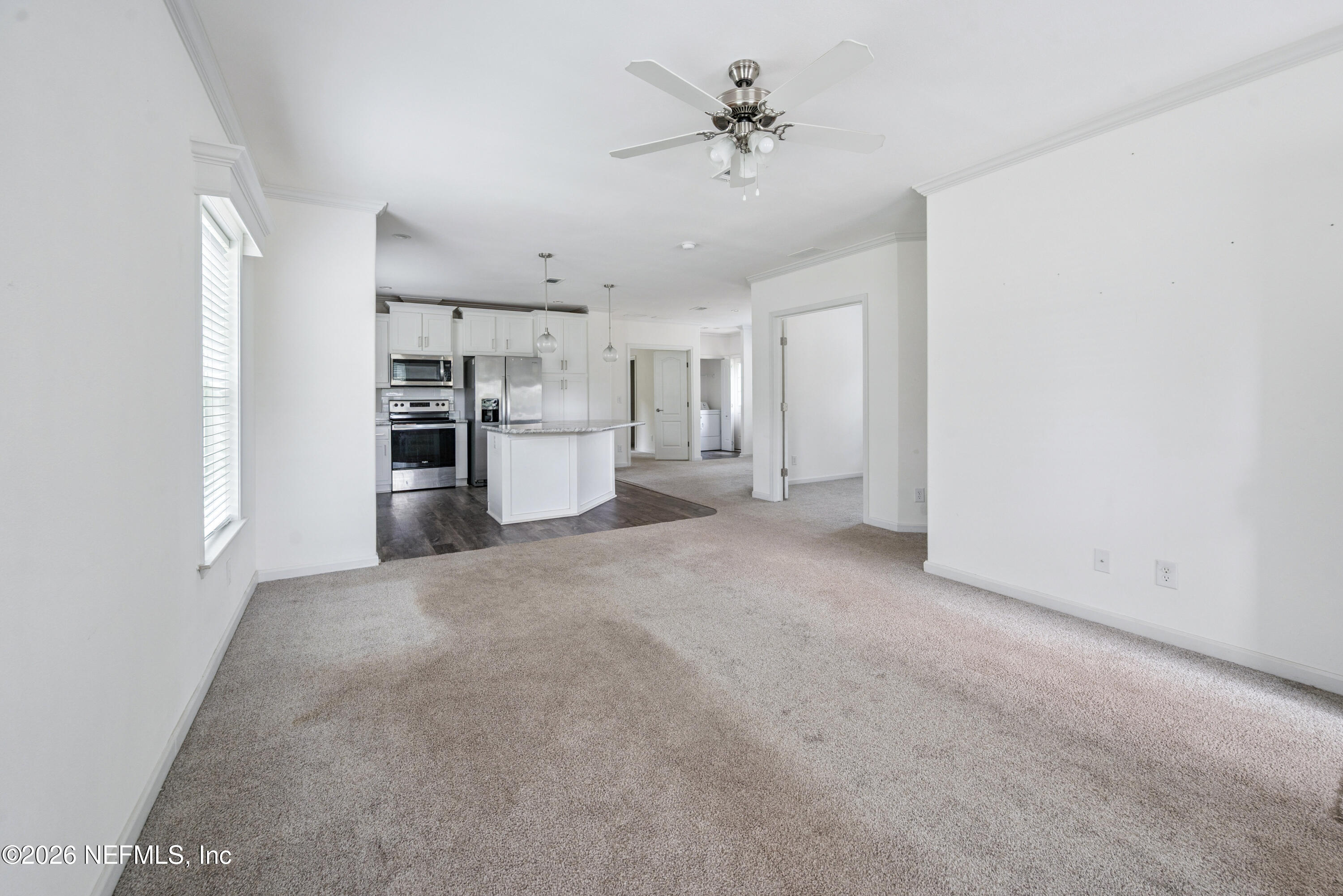 15049 Southwest 75th Avenue Starke, FL 32091 - Photo 38 of 64 a view of a kitchen with a sink and a refrigerator