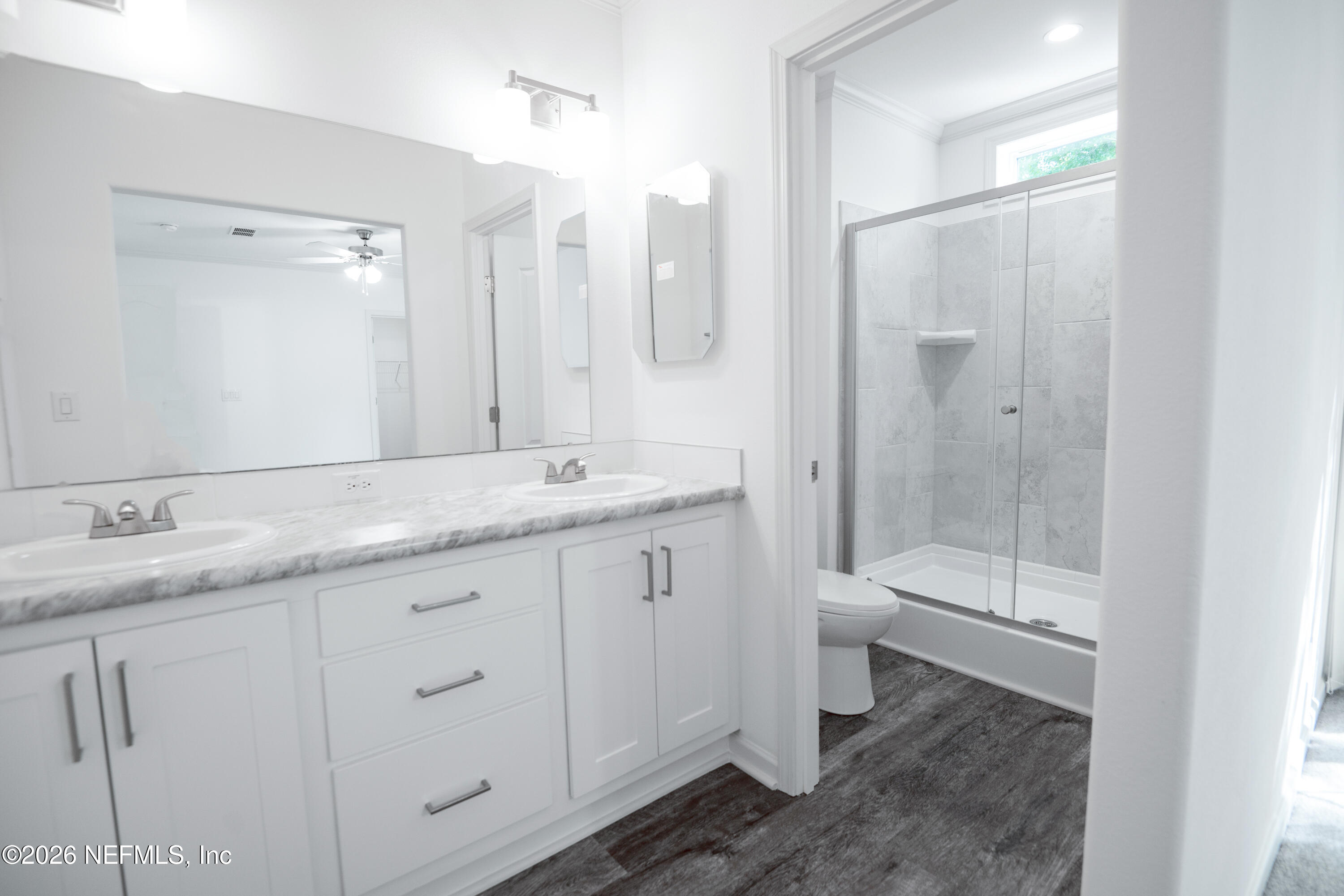 15049 Southwest 75th Avenue Starke, FL 32091 - Photo 4 of 64 a bathroom with a granite countertop sink toilet and shower