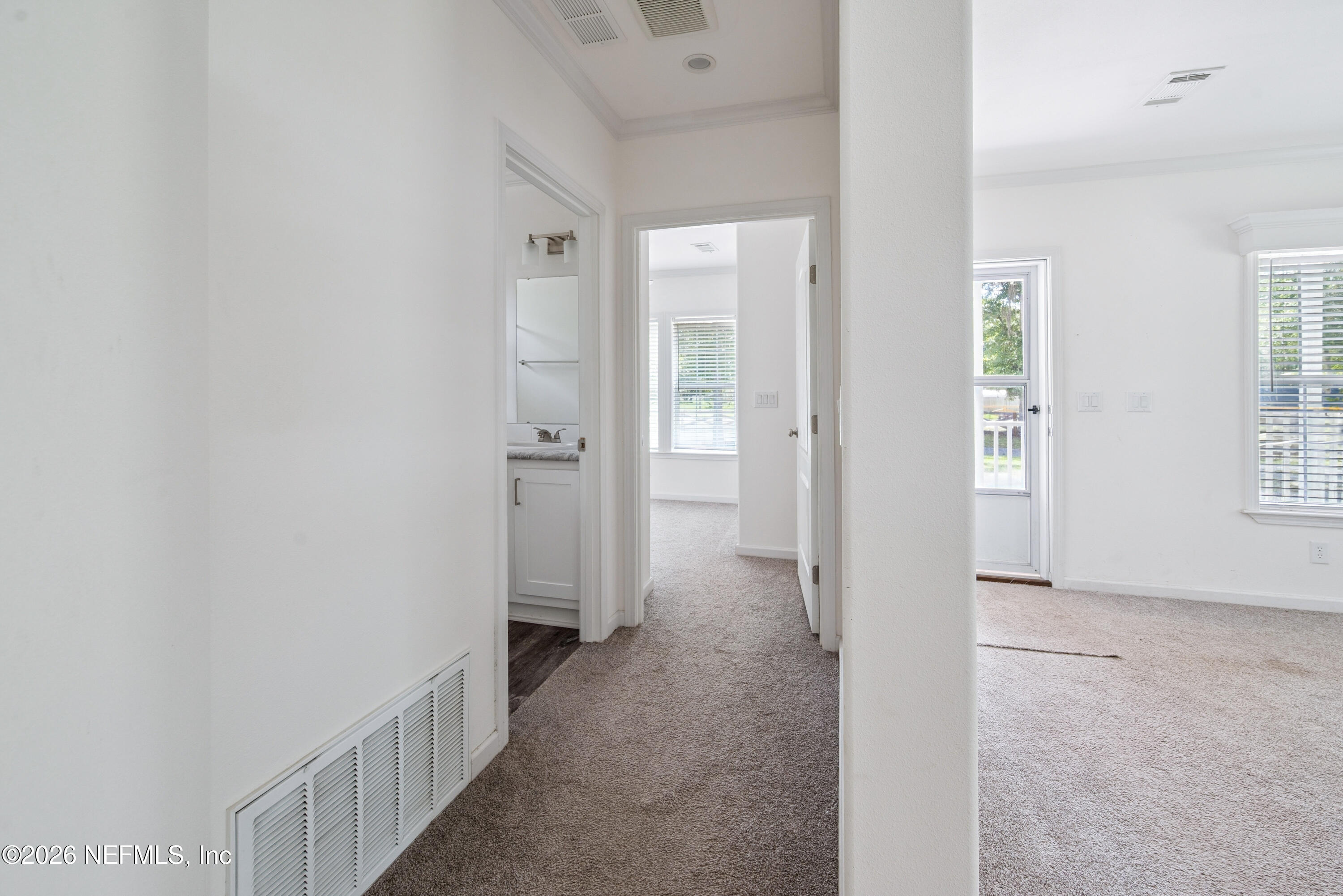 15049 Southwest 75th Avenue Starke, FL 32091 - Photo 41 of 64 a view of a hallway with a livingroom and a bathroom