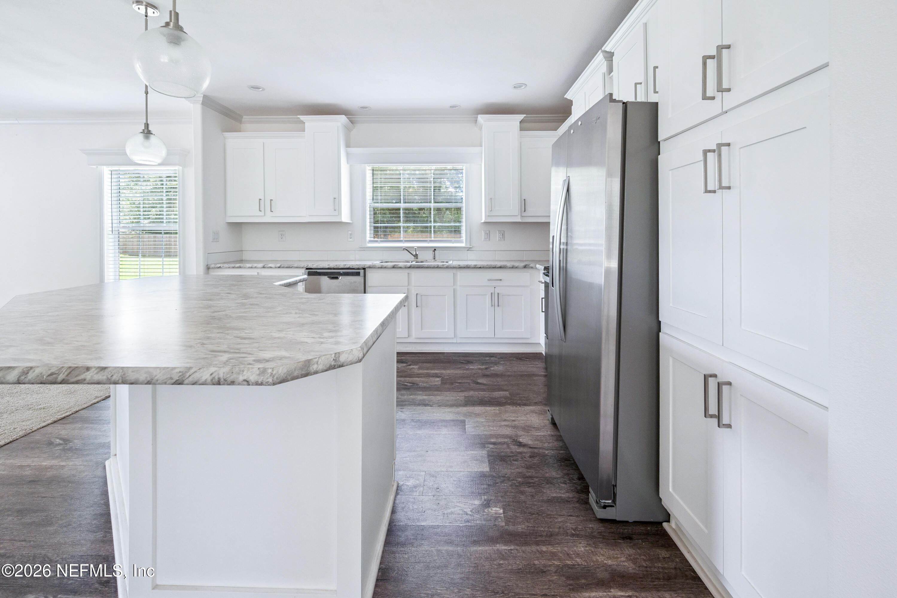 15049 Southwest 75th Avenue Starke, FL 32091 - Photo 45 of 64 a kitchen with stainless steel appliances granite countertop a refrigerator and a sink