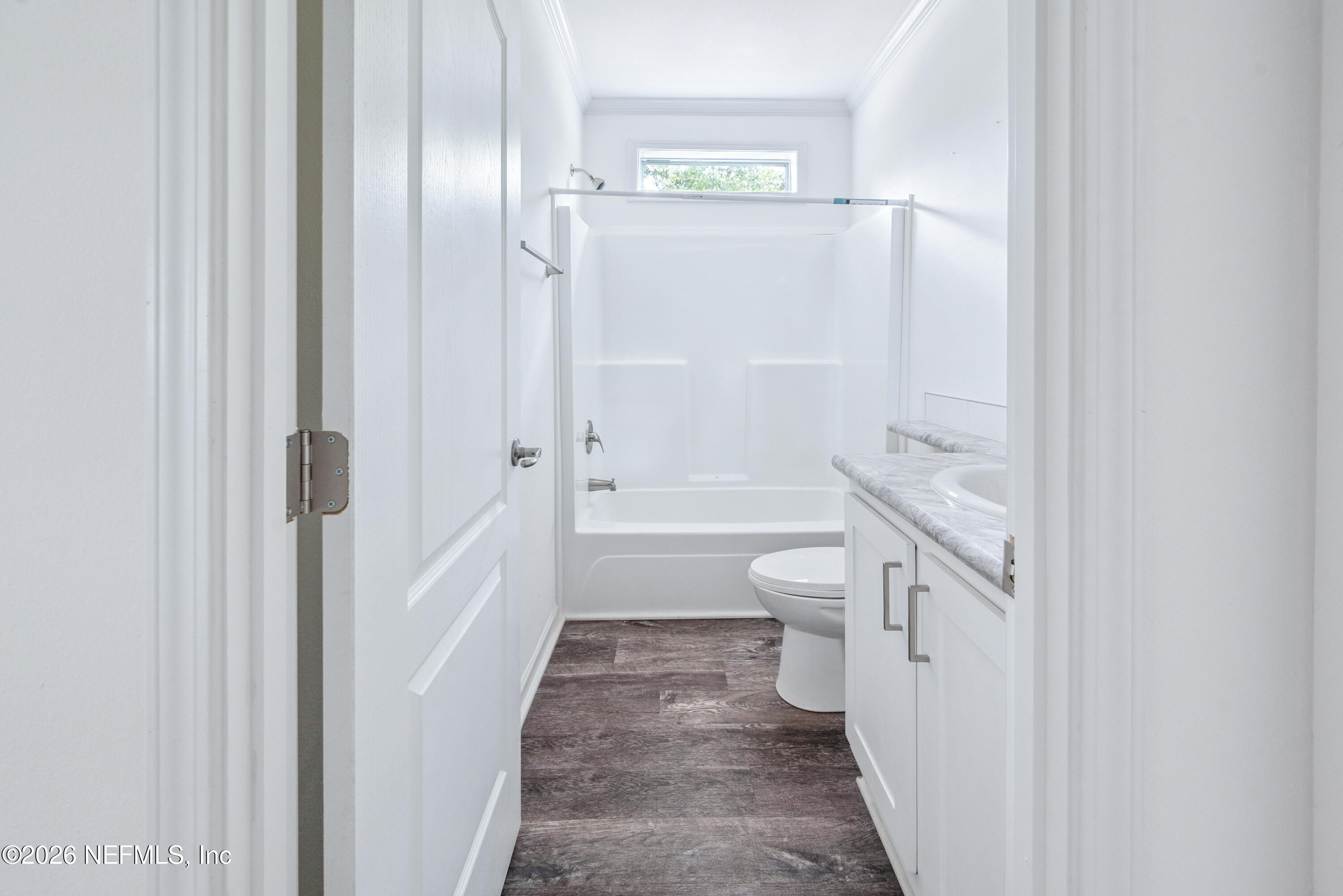15049 Southwest 75th Avenue Starke, FL 32091 - Photo 51 of 64 a bathroom with a tub shower sink and mirror