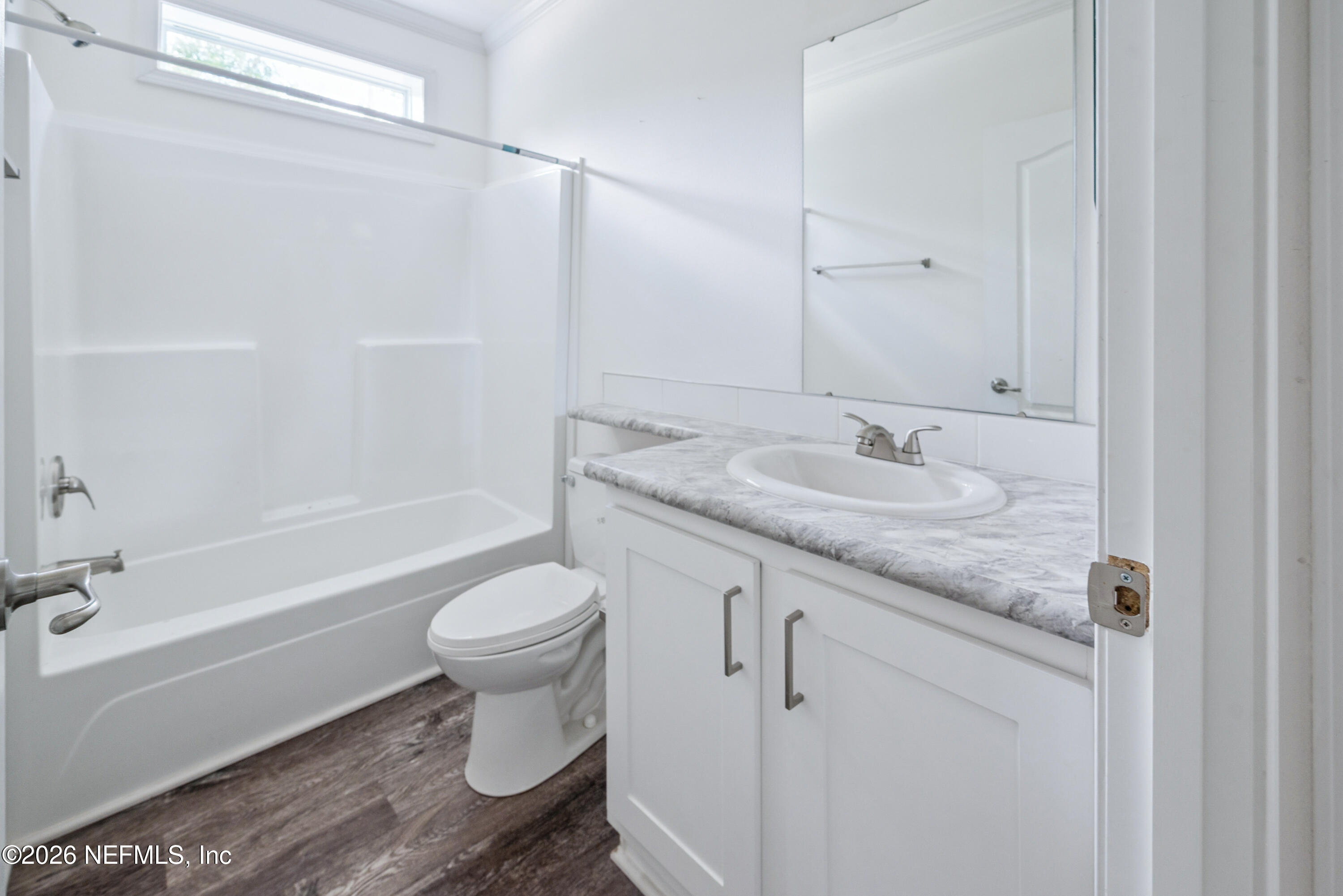15049 Southwest 75th Avenue Starke, FL 32091 - Photo 52 of 64 a bathroom with a granite countertop sink toilet and shower