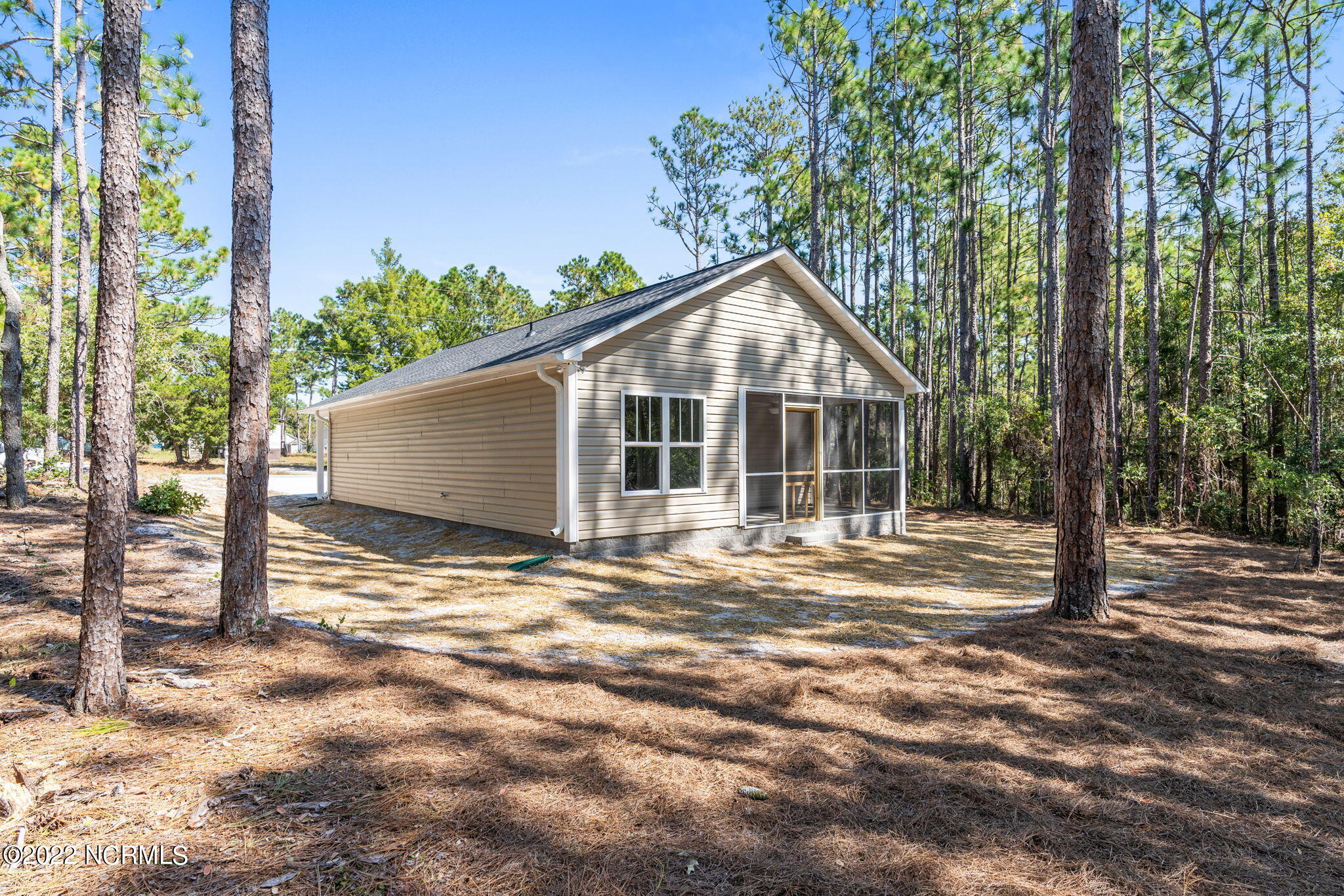 149 Elm Road Southport, NC 28461 - Photo 7 of 44 29 Side and Porch