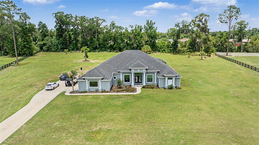 7403 Northeast 22nd Ct Road Ocala, FL 34479 - Photo 34 of 37 a view of a house with a big yard