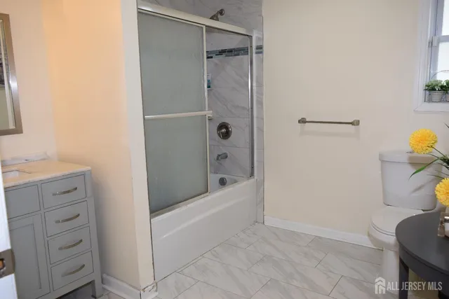 a bathroom with a shower and a tub