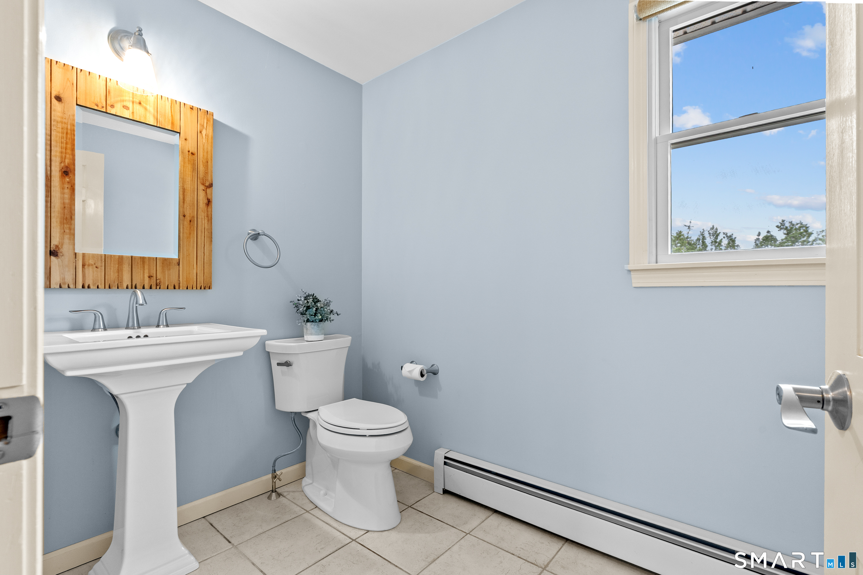 71 Quail Run Road Suffield, CT 06078 - Photo 10 of 40 Main floor half bath.