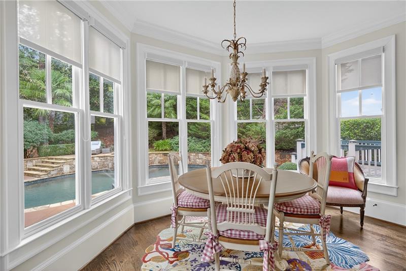 3100 Rhodenhaven Drive Northwest Atlanta, GA 30327 - Photo 18 of 52 a dining room with furniture large windows and wooden floor