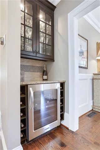 a living room with a bed furniture and a window