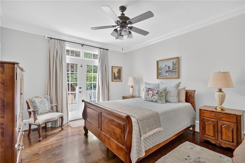 3100 Rhodenhaven Drive Northwest Atlanta, GA 30327 - Photo 26 of 52 a bedroom with a bed and a chandelier