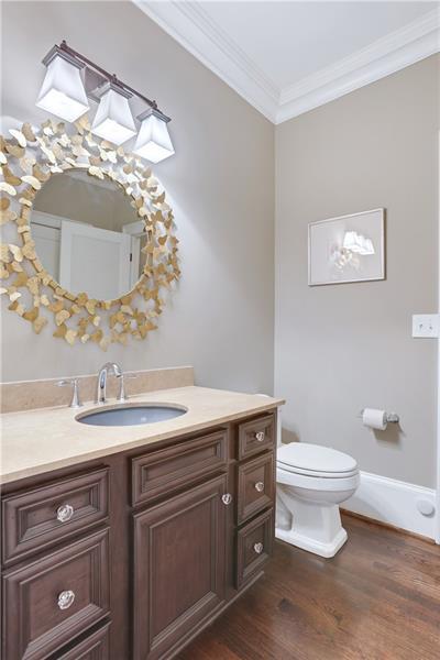 3100 Rhodenhaven Drive Northwest Atlanta, GA 30327 - Photo 27 of 52 a bathroom with a toilet sink and mirror