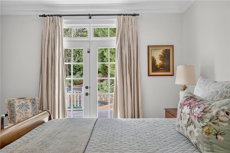 3100 Rhodenhaven Drive Northwest Atlanta, GA 30327 - Photo 30 of 52 a bedroom with a large bed and a window