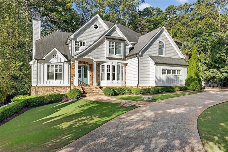 3100 Rhodenhaven Drive Northwest Atlanta, GA 30327 - Photo 3 of 52 a front view of a house with a yard