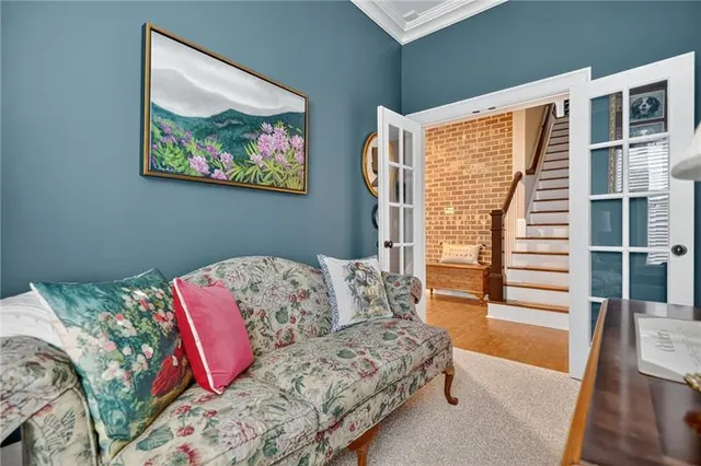 a bathroom with a granite countertop toilet a sink and a mirror