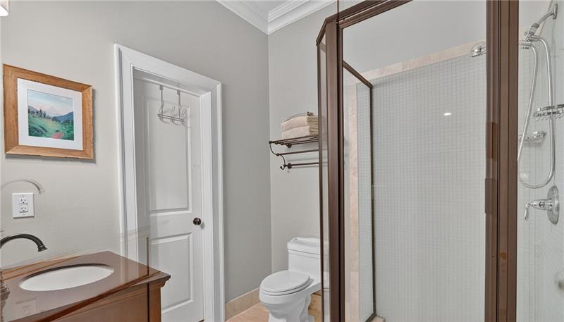 3100 Rhodenhaven Drive Northwest Atlanta, GA 30327 - Photo 39 of 52 a bathroom with a granite countertop toilet a sink and a mirror