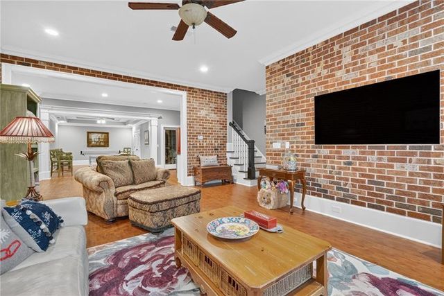 a kitchen with granite countertop a stove and white cabinets