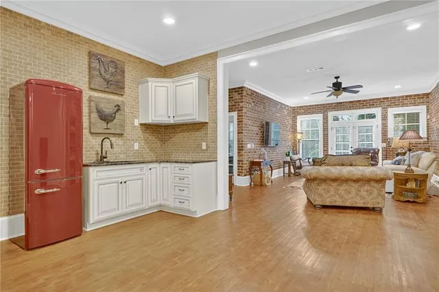 a view of a livingroom with furniture and a flat screen tv