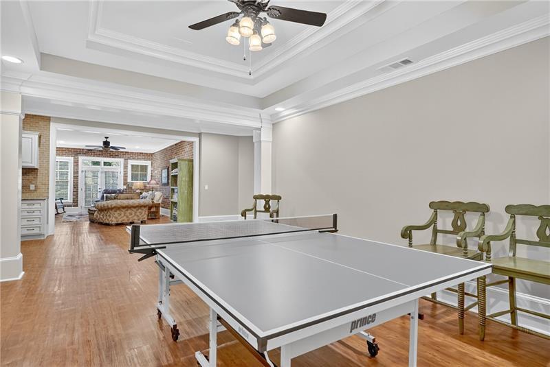 3100 Rhodenhaven Drive Northwest Atlanta, GA 30327 - Photo 45 of 52 a room with gym equipment and a chandelier