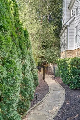 a view of yard with tree in front of it