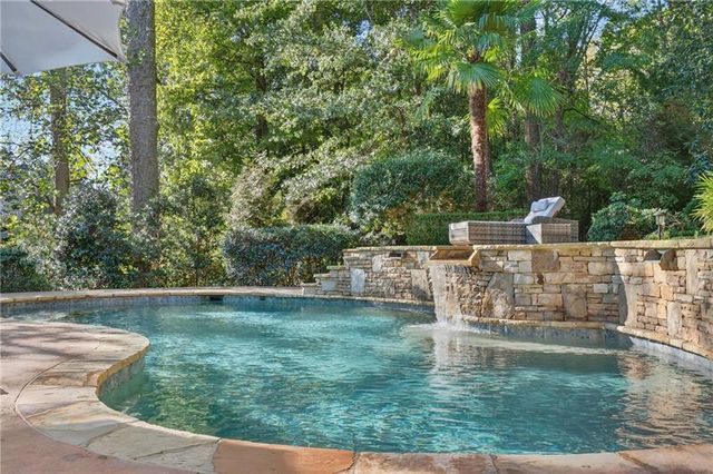 a view of a lake with a large trees