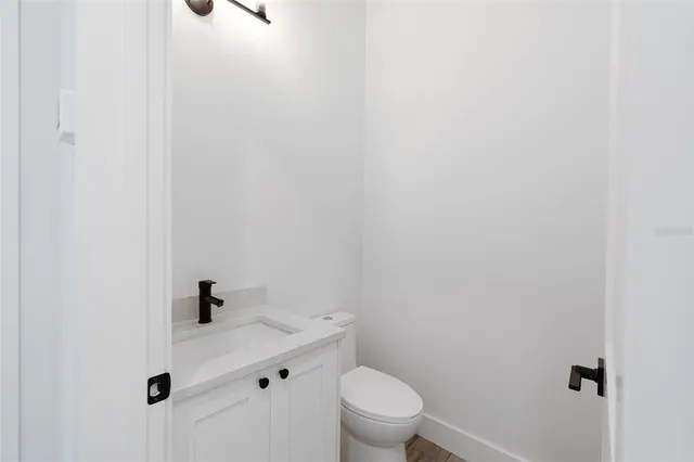 a bathroom with a toilet and a sink