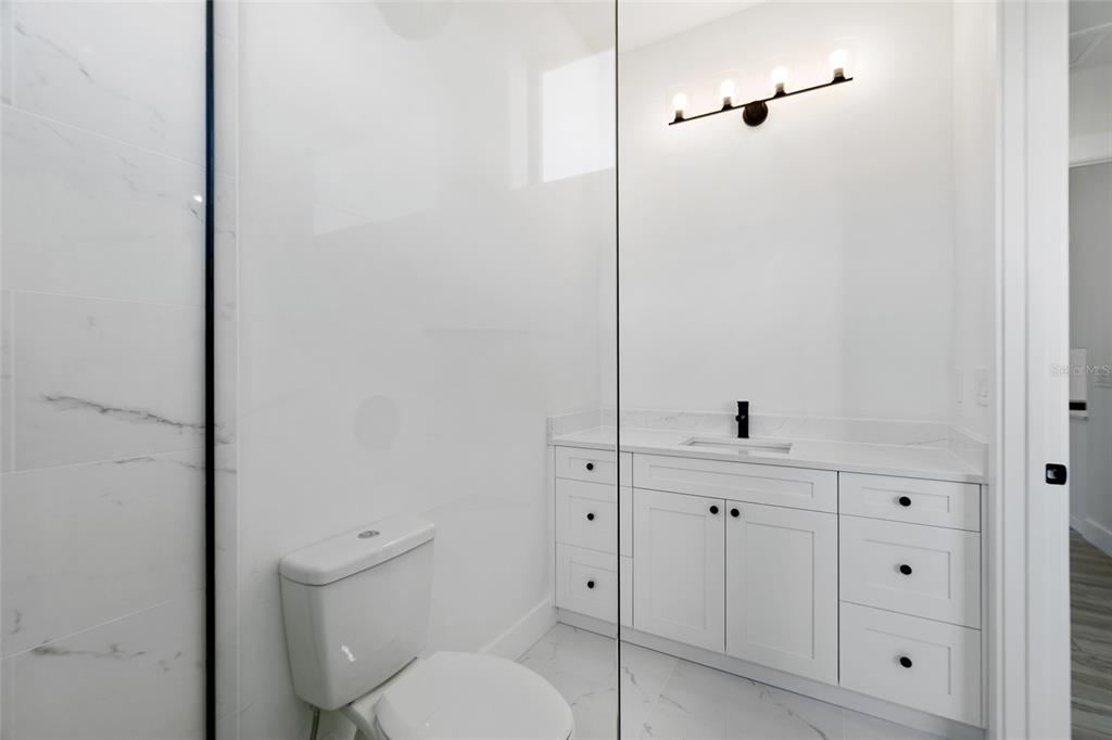 210 Tournament Road Rotonda West, FL 33947 - Photo 39 of 59 a bathroom with a toilet and a sink