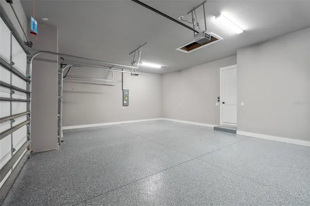 a view of a house with a yard and palm trees