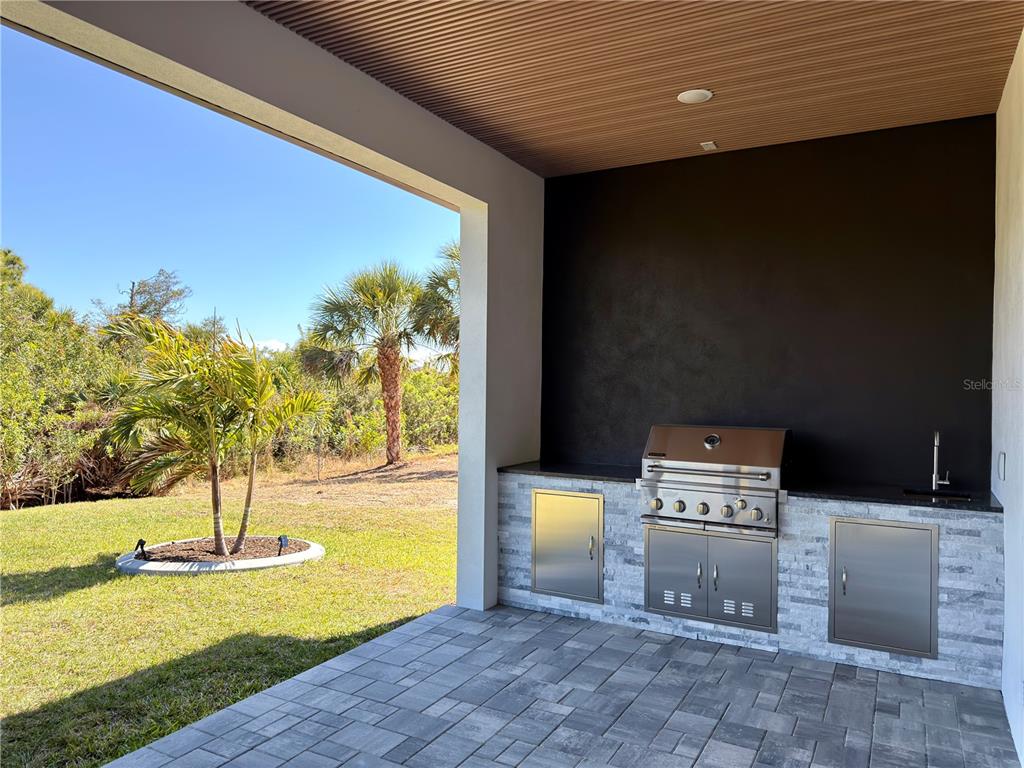 210 Tournament Road Rotonda West, FL 33947 - Photo 46 of 59 a view of a swimming pool with an outdoor space and seating area