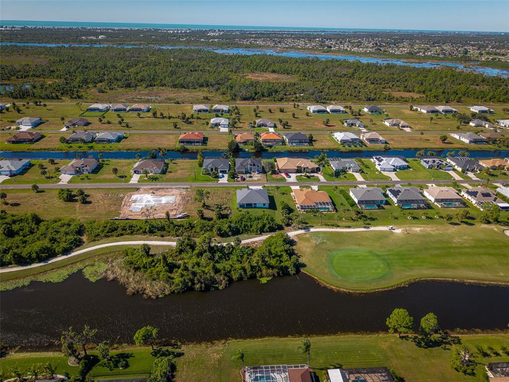 210 Tournament Road Rotonda West, FL 33947 - Photo 50 of 59 an aerial view of ocean and residential houses with outdoor space