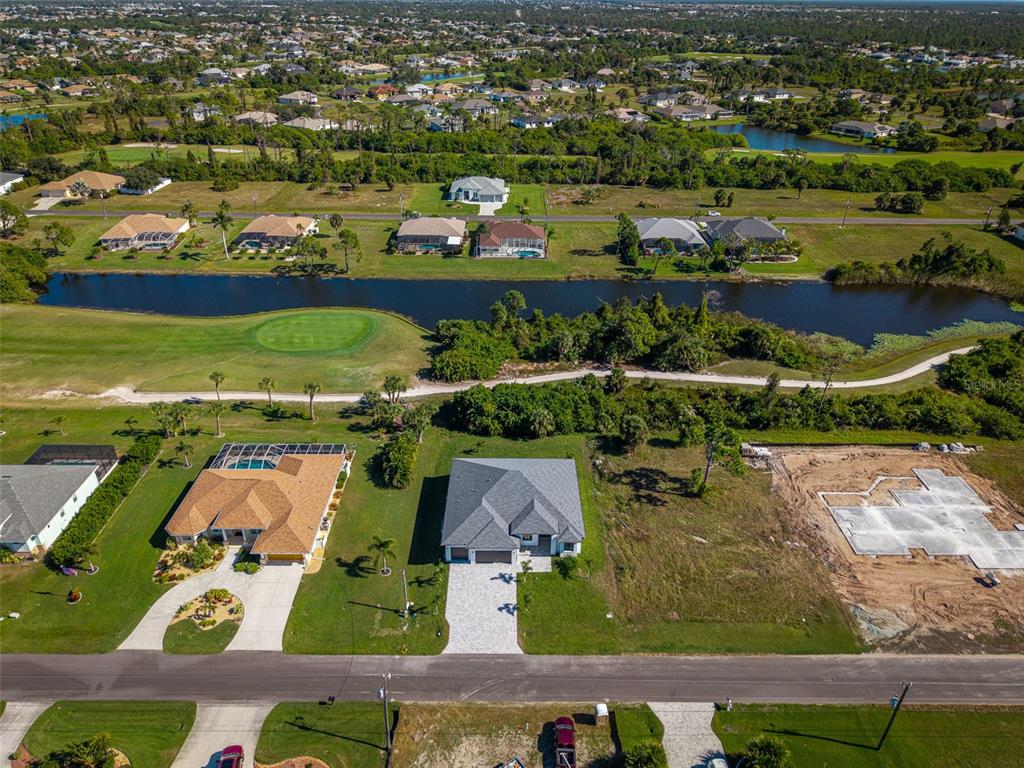 210 Tournament Road Rotonda West, FL 33947 - Photo 52 of 59 an aerial view of residential houses with outdoor space and river