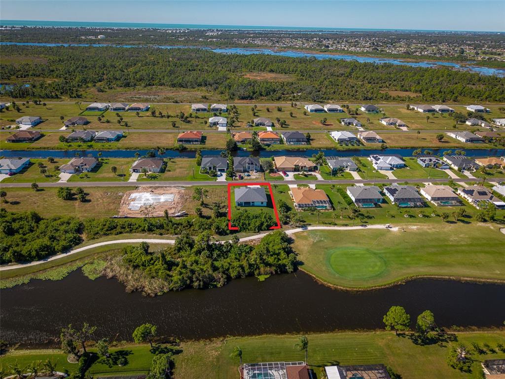 210 Tournament Road Rotonda West, FL 33947 - Photo 54 of 59 an aerial view of ocean and residential houses with outdoor space