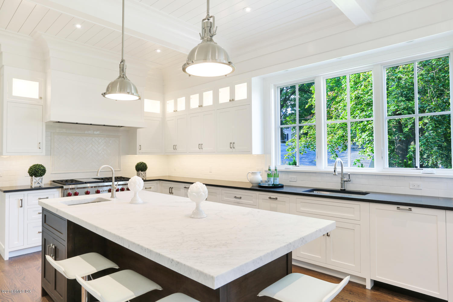 3 Juniper Lane Riverside, CT 06878 - Photo 11 of 30 a kitchen with a sink a window and cabinets