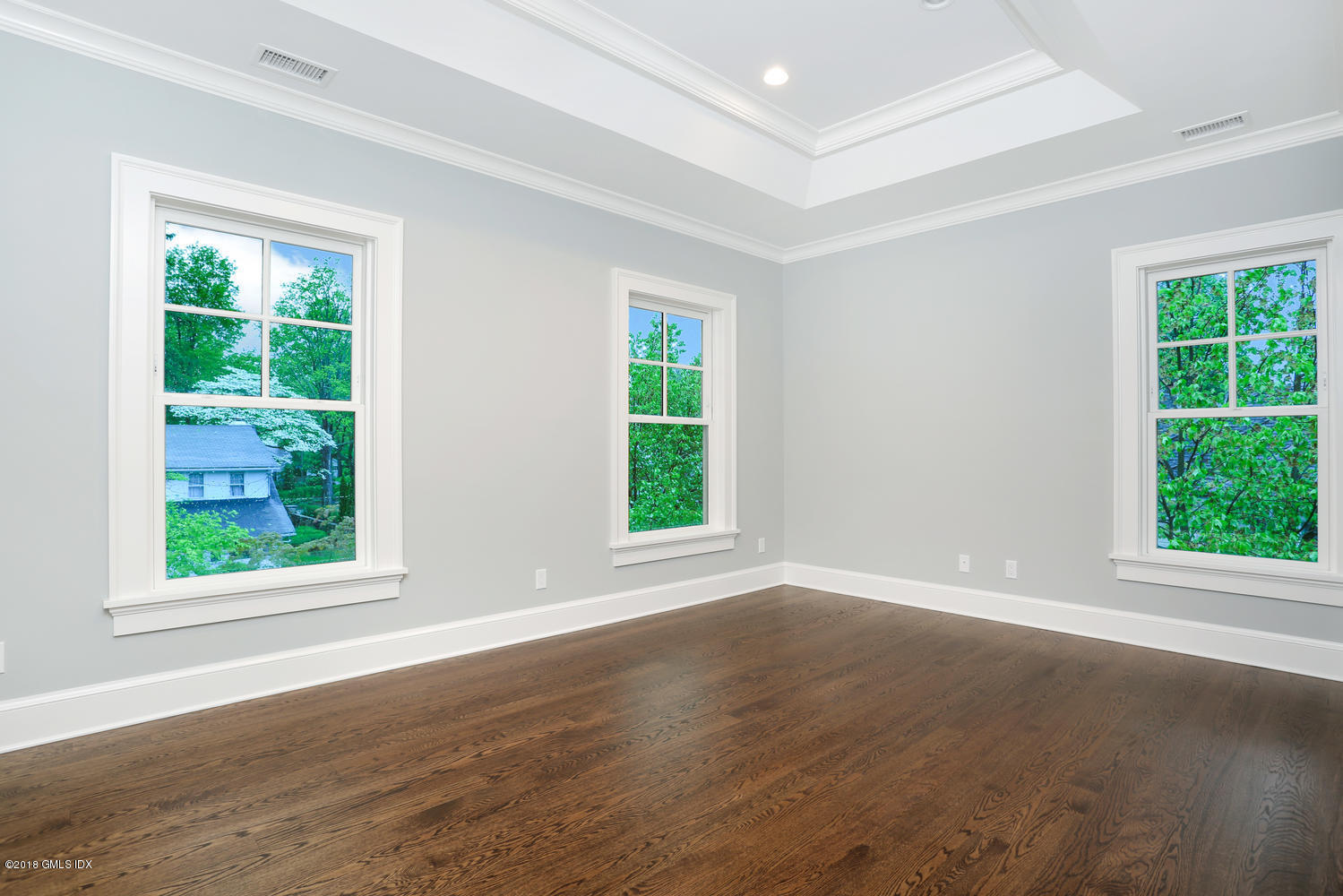 3 Juniper Lane Riverside, CT 06878 - Photo 22 of 30 an empty room with wooden floor and windows