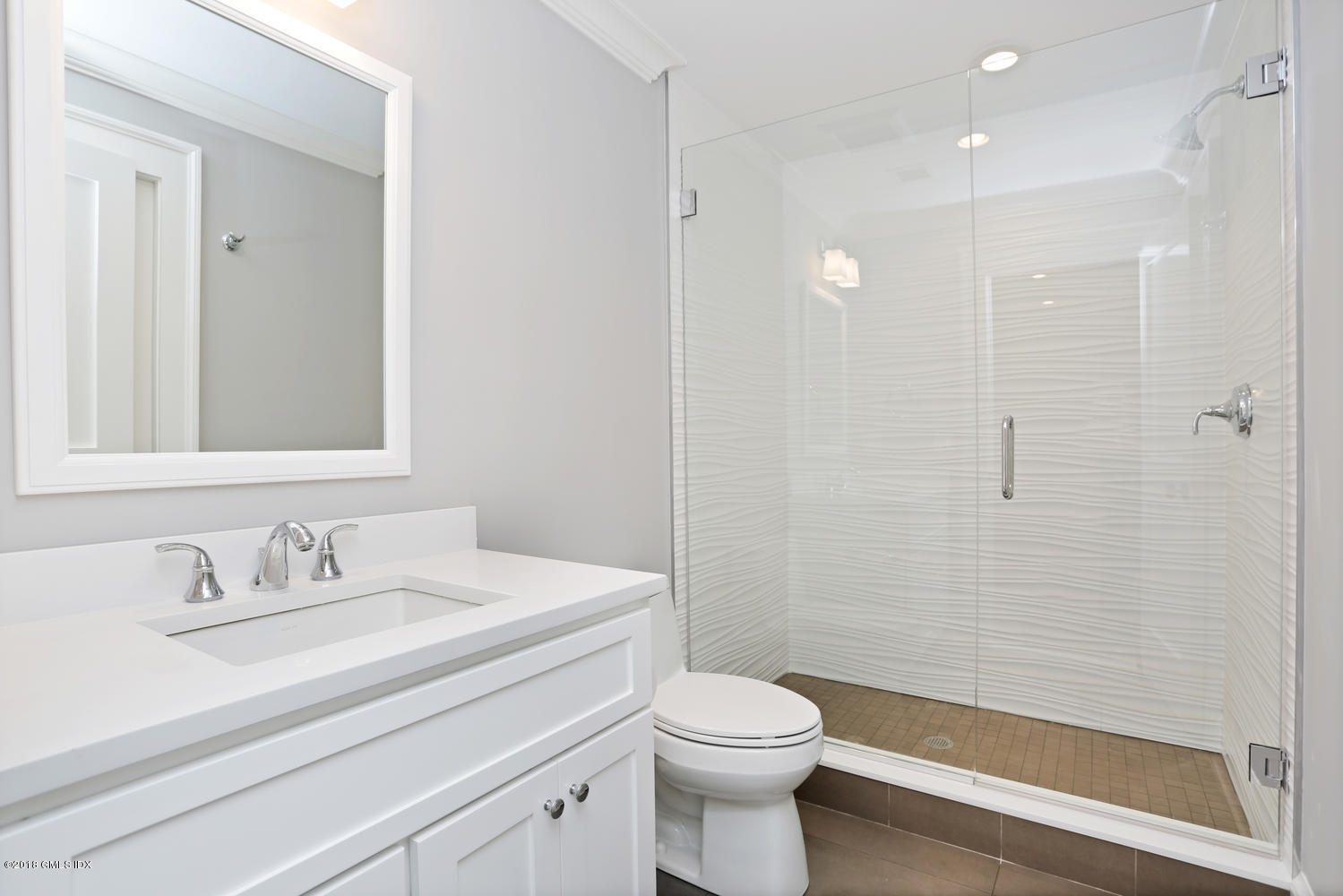 3 Juniper Lane Riverside, CT 06878 - Photo 26 of 30 a bathroom with a sink a toilet and shower