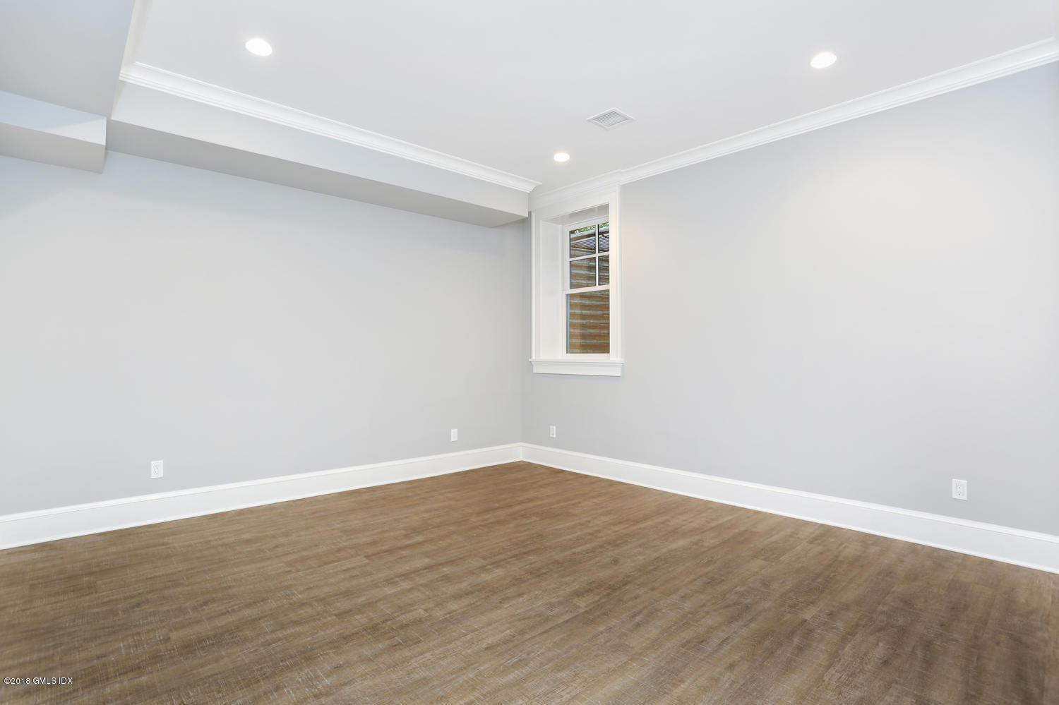 3 Juniper Lane Riverside, CT 06878 - Photo 27 of 30 an empty room with wooden floor and windows