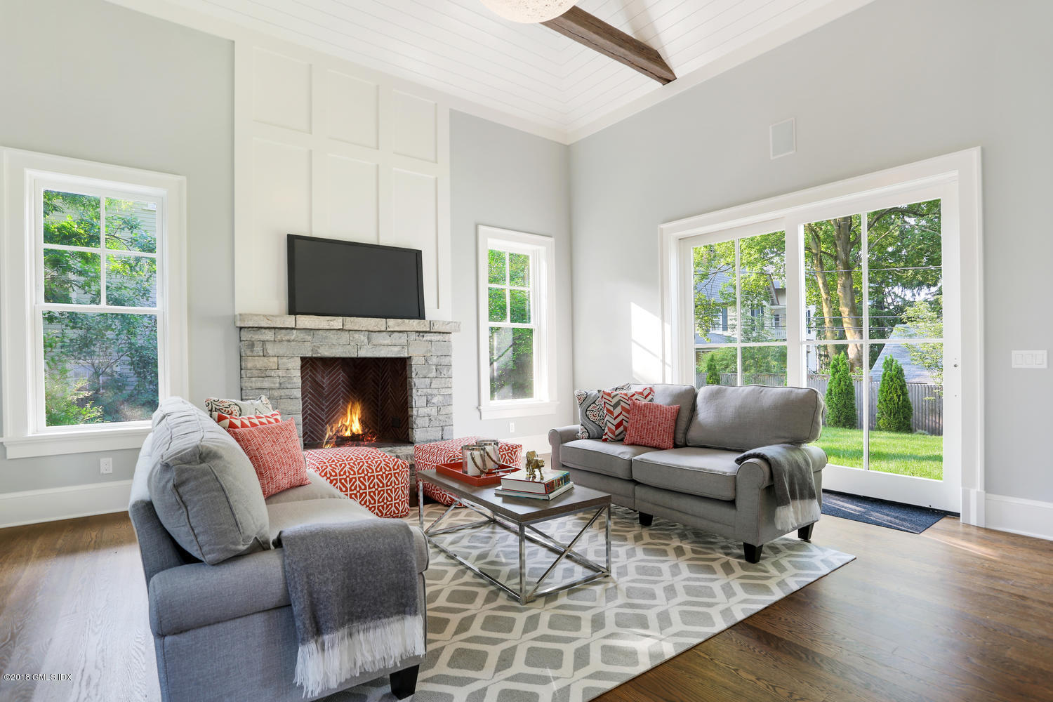 3 Juniper Lane Riverside, CT 06878 - Photo 8 of 30 a living room with furniture a large window and a fireplace