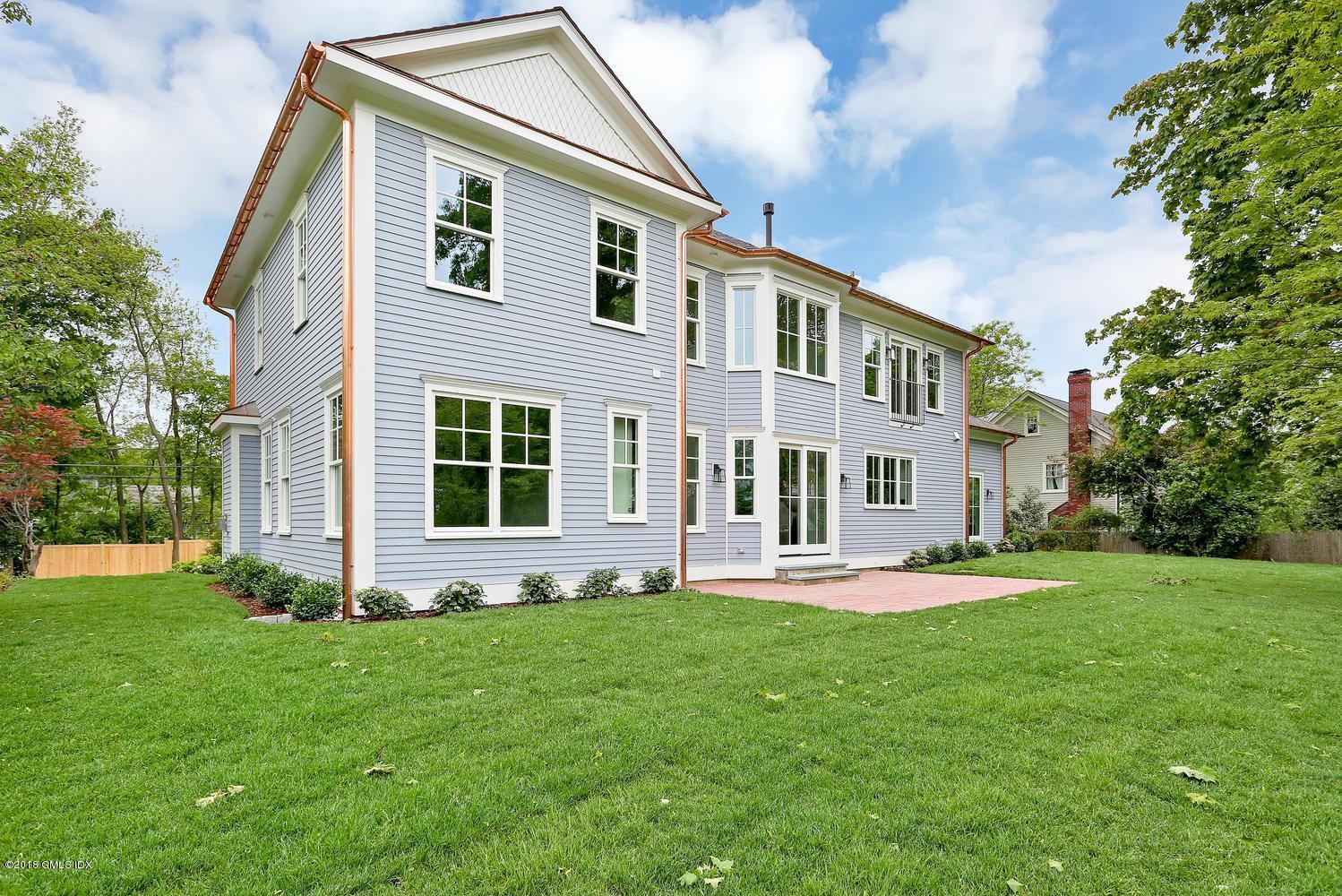 3 Juniper Lane Riverside, CT 06878 - Photo 9 of 30 a front view of a house with a yard