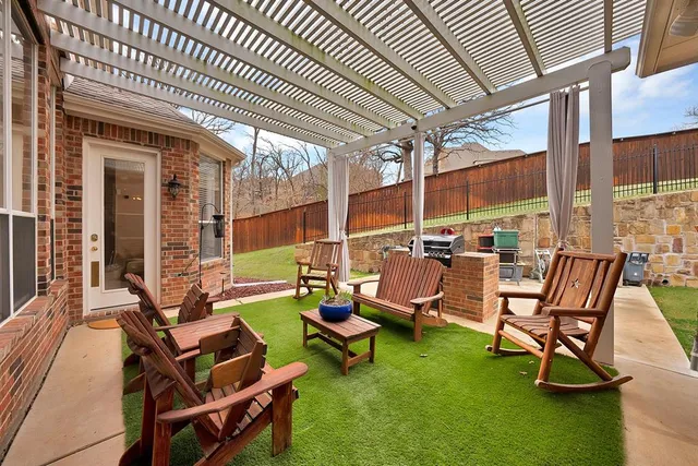 a front view of a house with a garden and yard