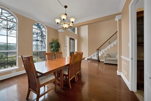 a view of a dining room with furniture window and wooden floor