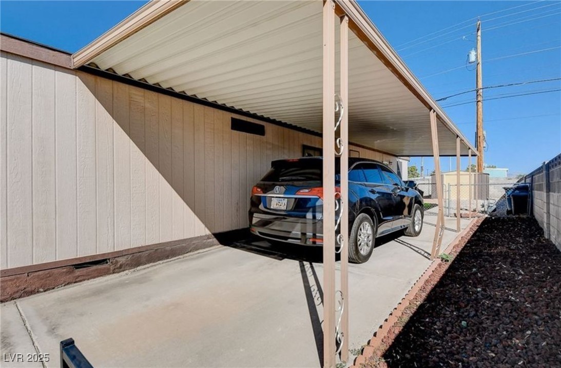 5576 Aldama Road Las Vegas, NV 89122 - Photo 21 of 23 View of vehicle parking with a carport