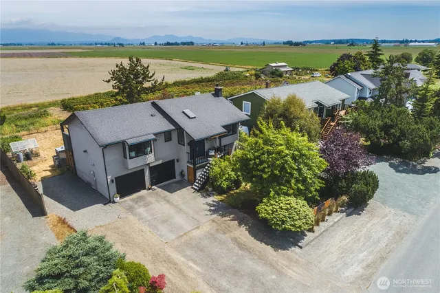 an aerial view of a house with a lake view