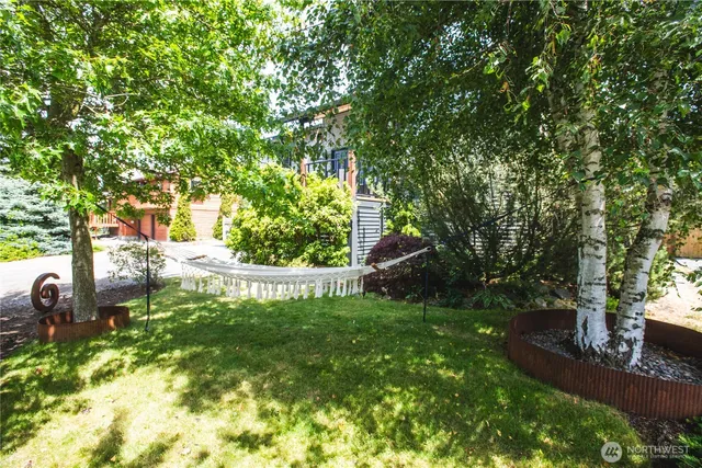 a kitchen with a sink and a mirror