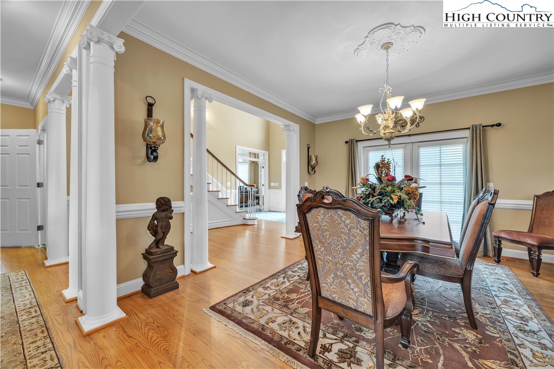 891 Olde Charter Circle Jefferson, NC 28640 - Photo 16 of 49 a view of a dining room with furniture and a chandelier