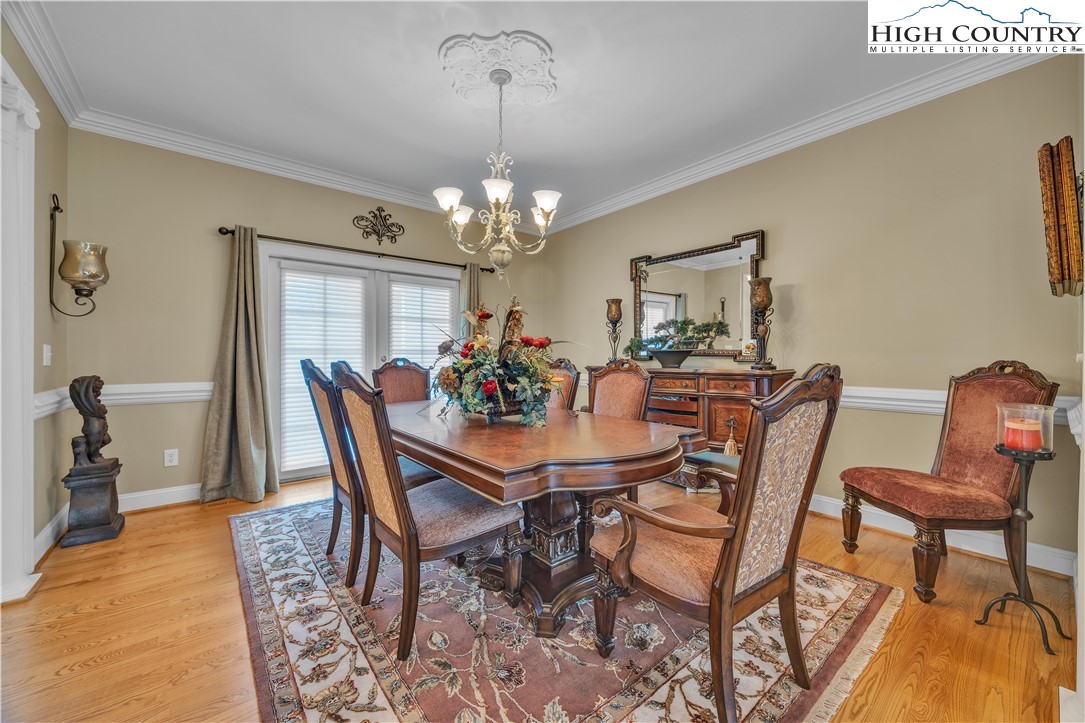 891 Olde Charter Circle Jefferson, NC 28640 - Photo 17 of 49 a view of a dining room with furniture and chandelier