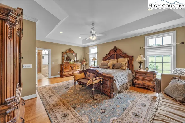 a bedroom with furniture and a window