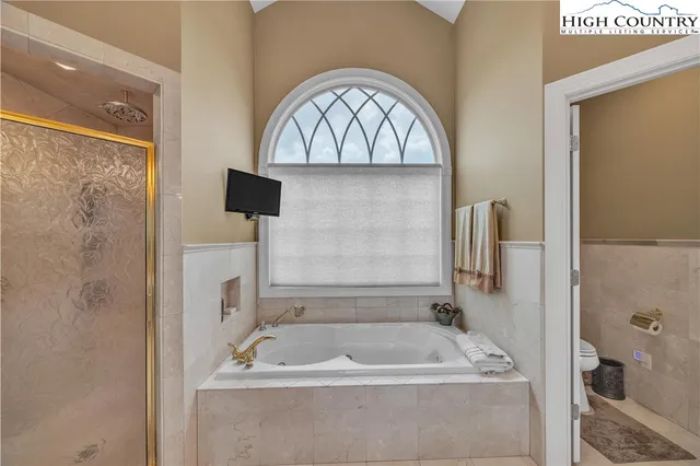 a bath tub sitting next to a bathroom sink